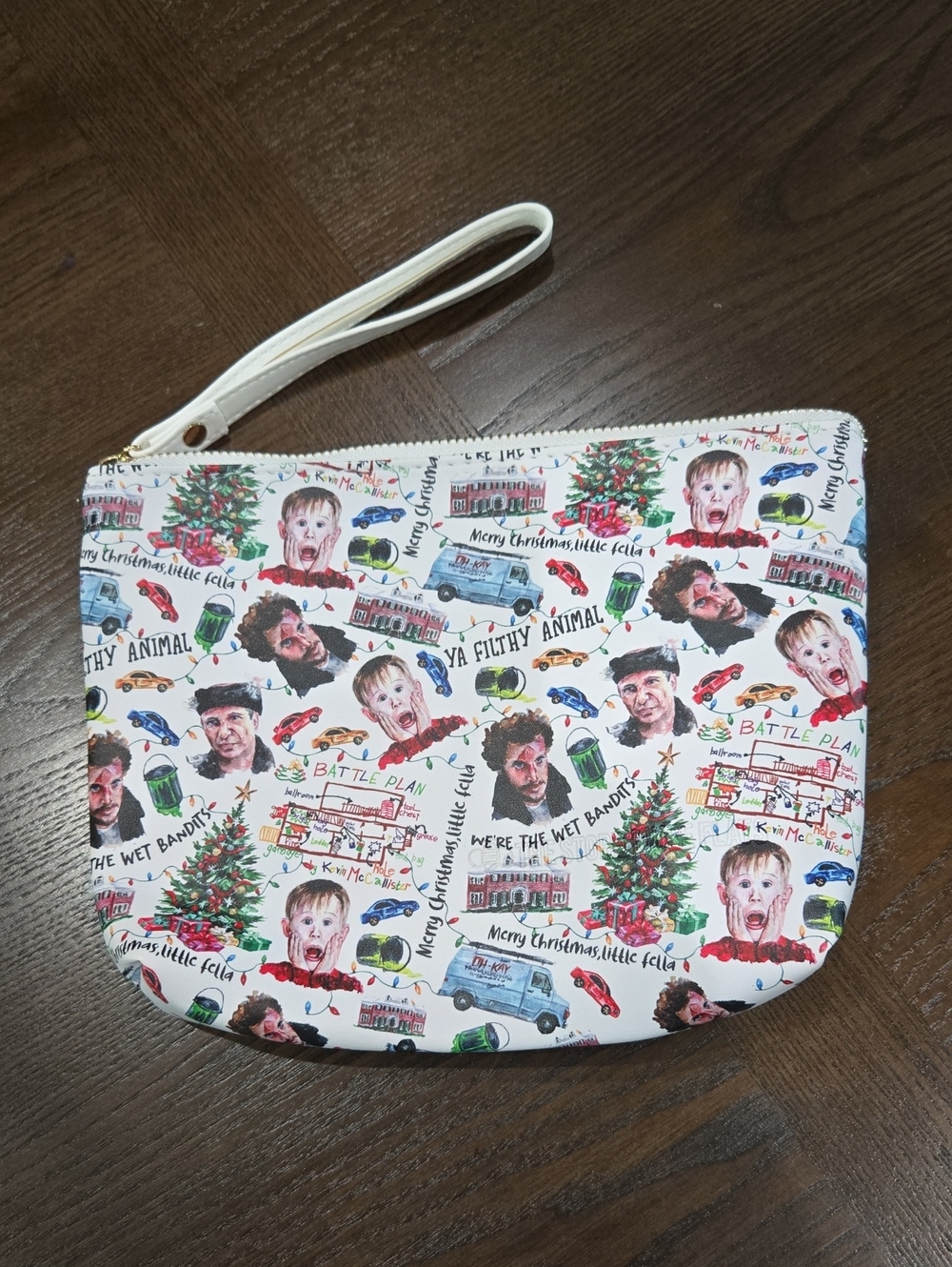 The Storehouse Flats Home Alone White Holiday Print Wristlet Pouch
